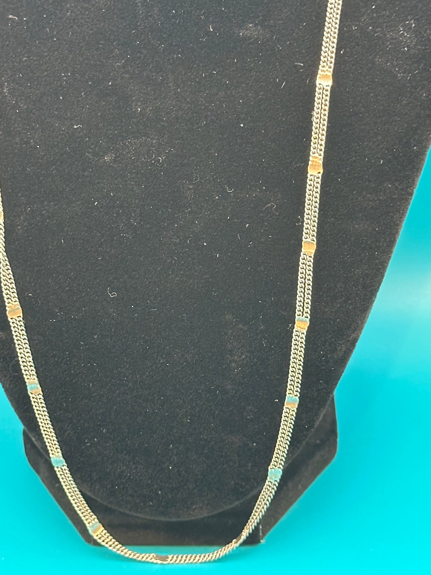 Attractive, light and airy fashion chain-link necklace. Three strands. It looks like sterling, but is unmarked.