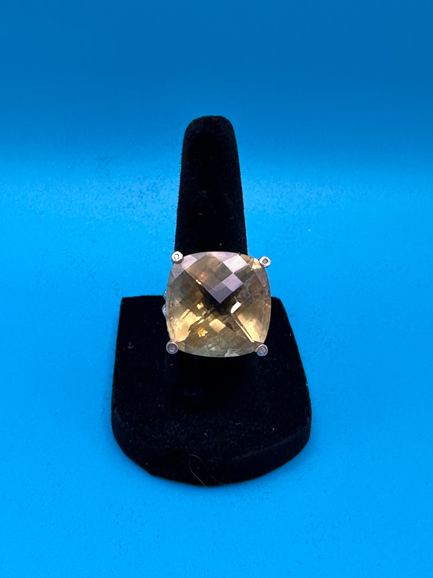 Lemon quartz cushion-cut stone in a sterling silver ring in rope setting