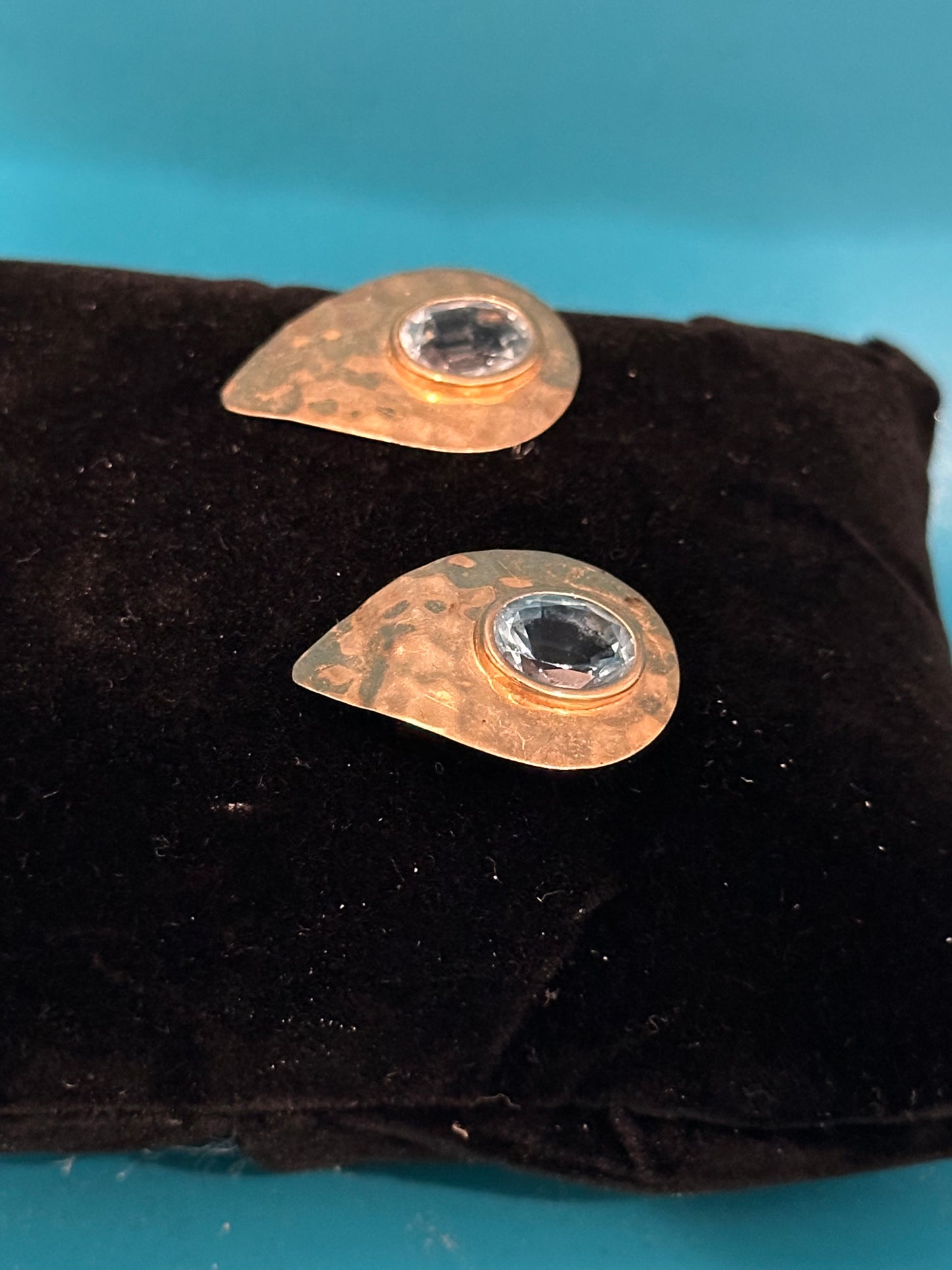 Contemporary hammered gold and blue topaz post earrings