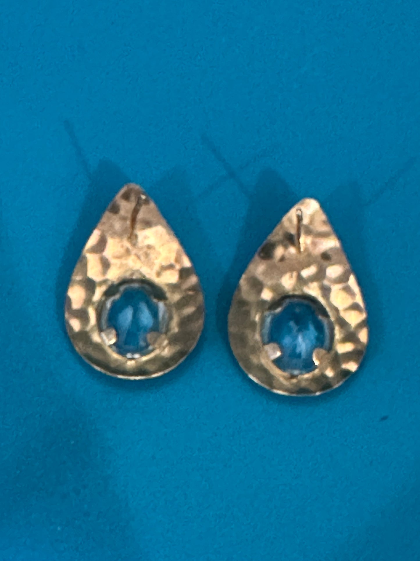 Contemporary hammered gold and blue topaz post earrings