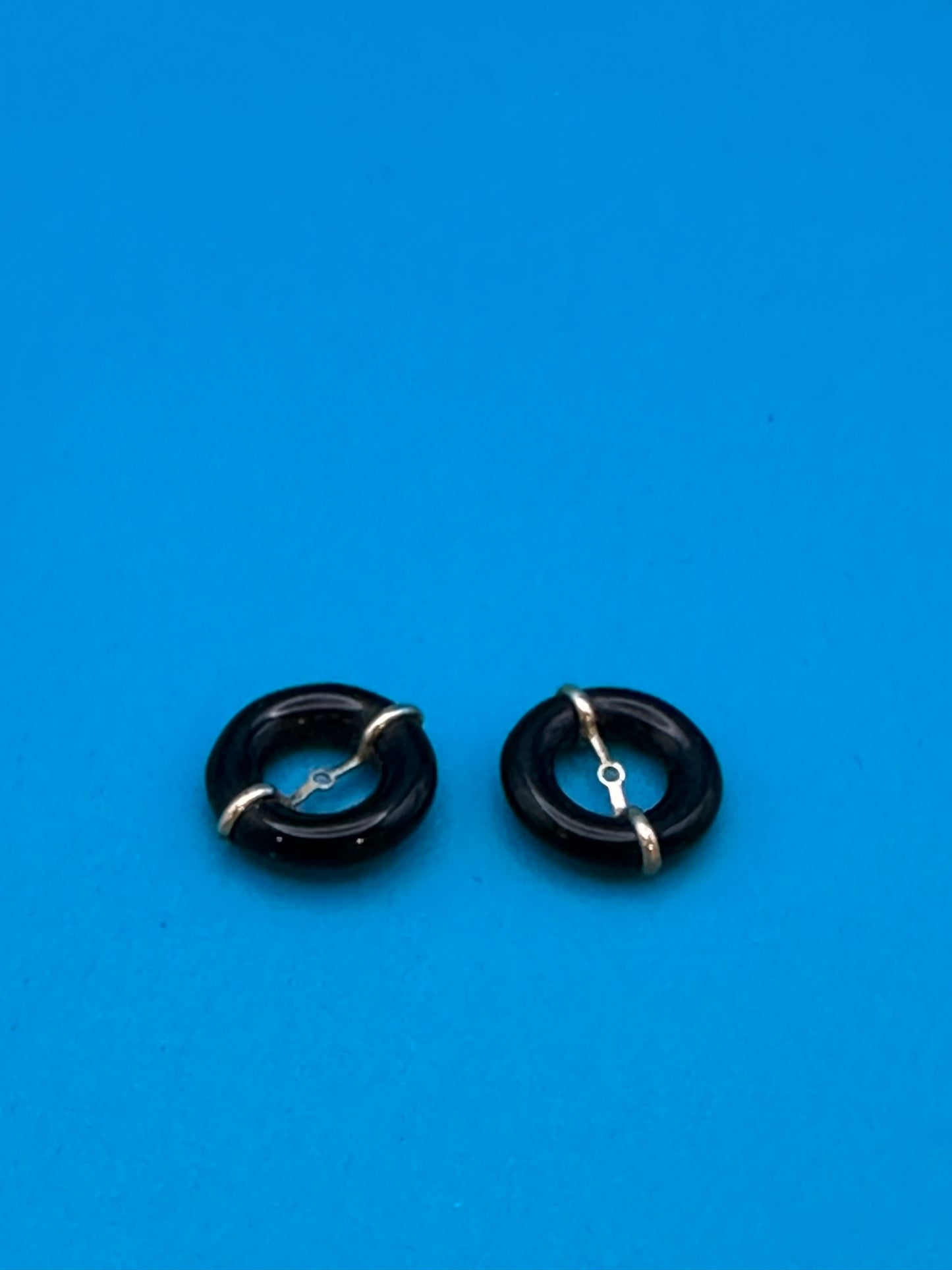 gold and onyx stud-surround