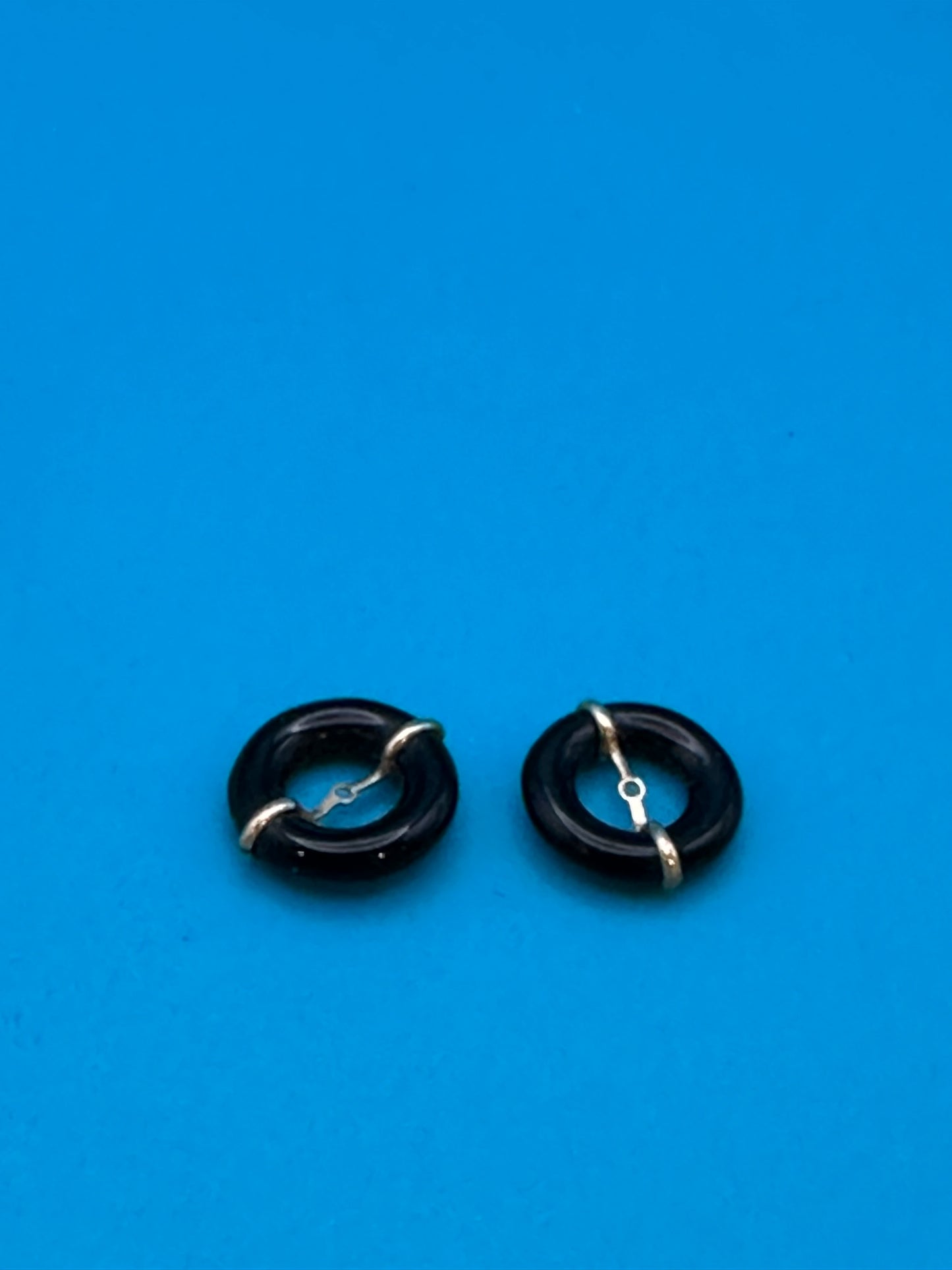 gold and onyx stud-surround