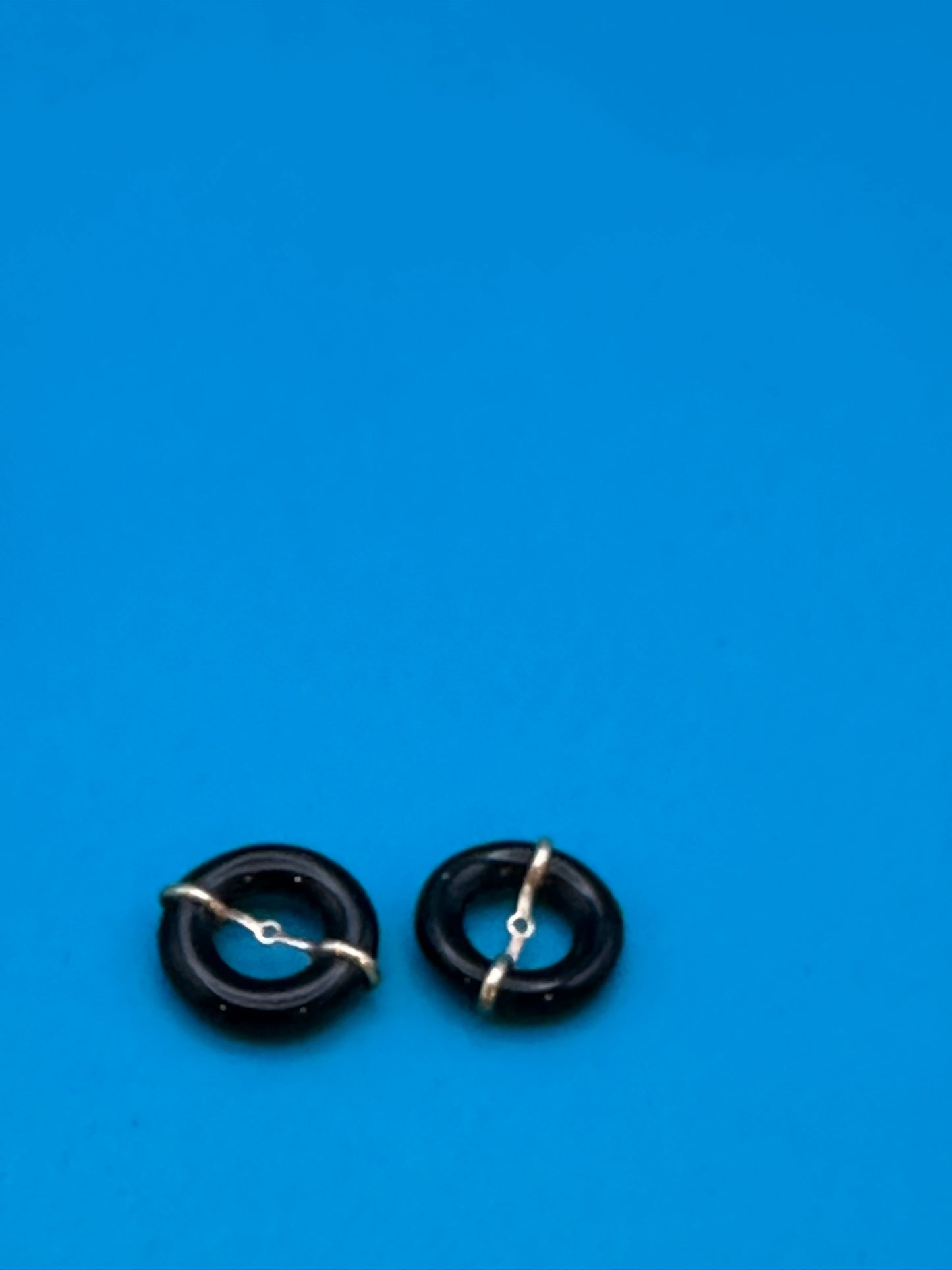 gold and onyx stud-surround