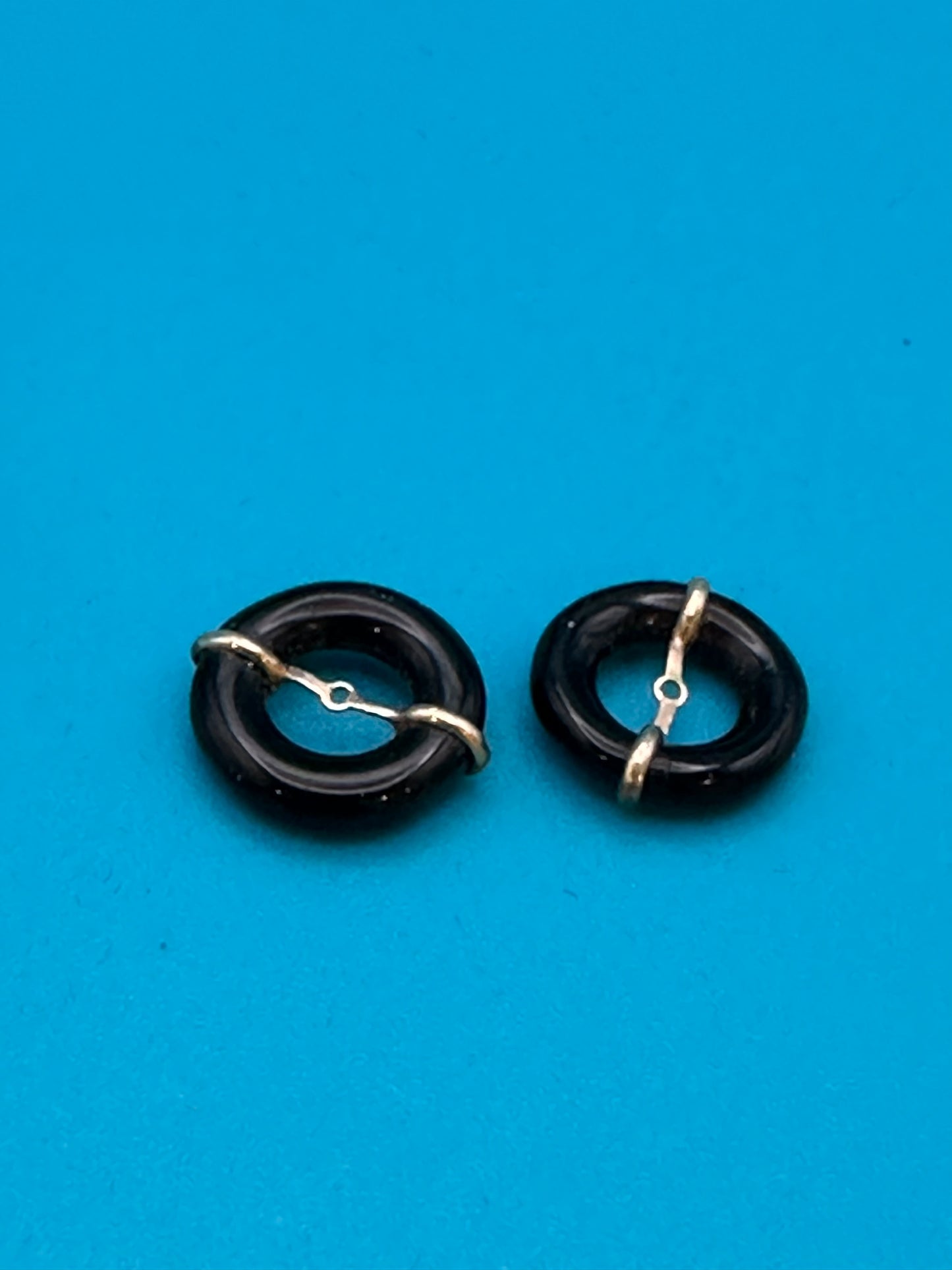 gold and onyx stud-surround