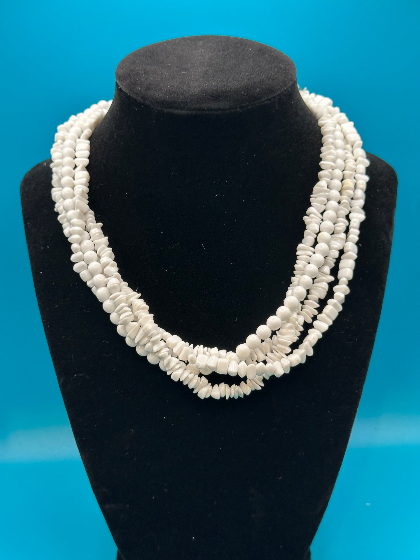 White plastic torsade necklace