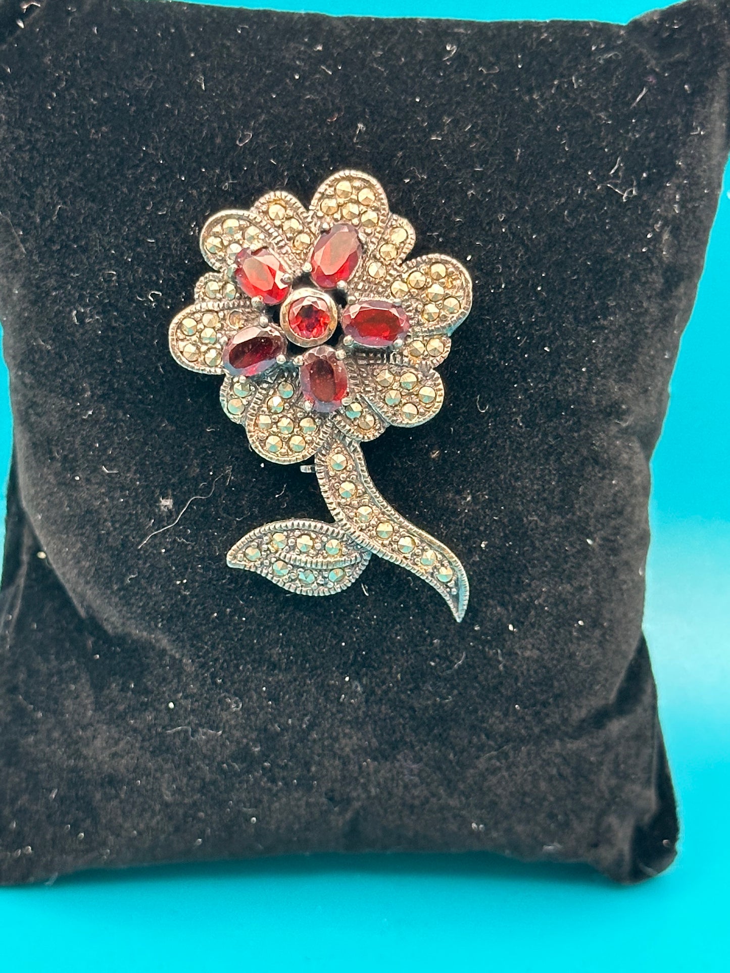 Vintage 925 sterling silver, marcasite, and garnet flower brooch