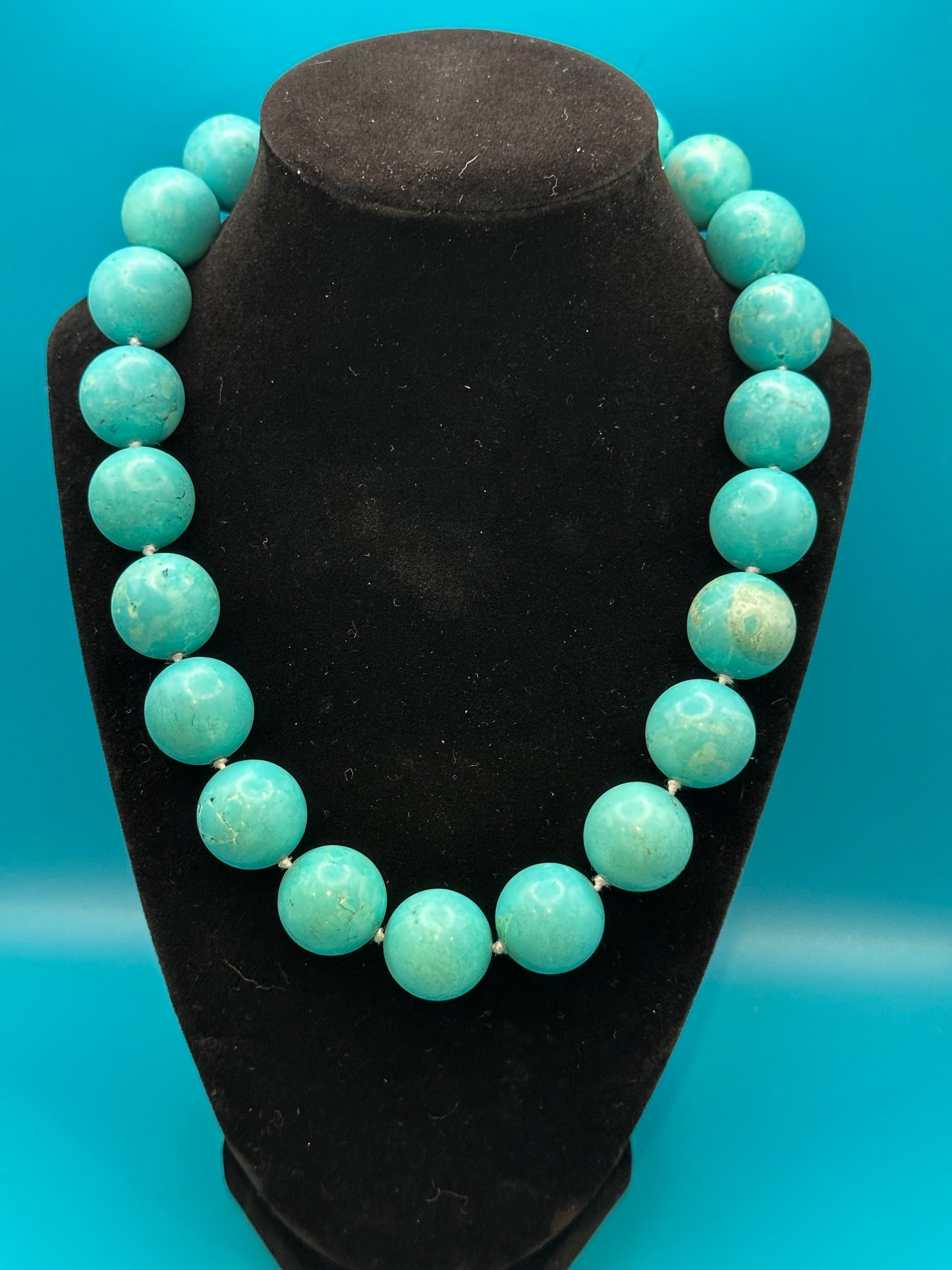 Vintage turquoise choker necklace. There are knots between each bead. Very large beads with silver metal clasp. Excellent condition