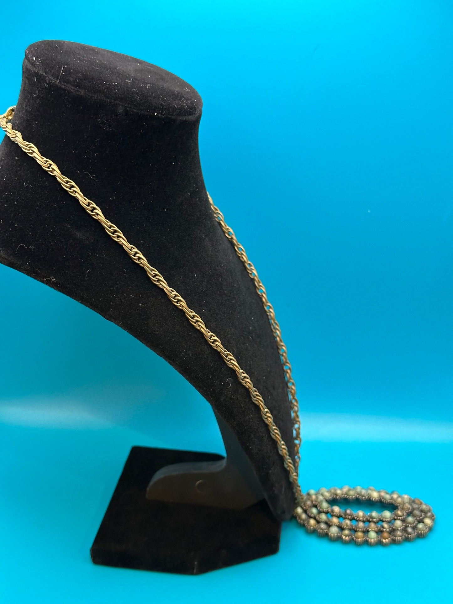 Oval stone pendant on gold chain