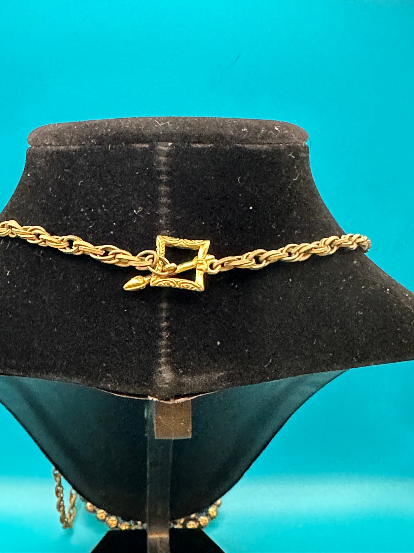 Oval stone pendant on gold chain