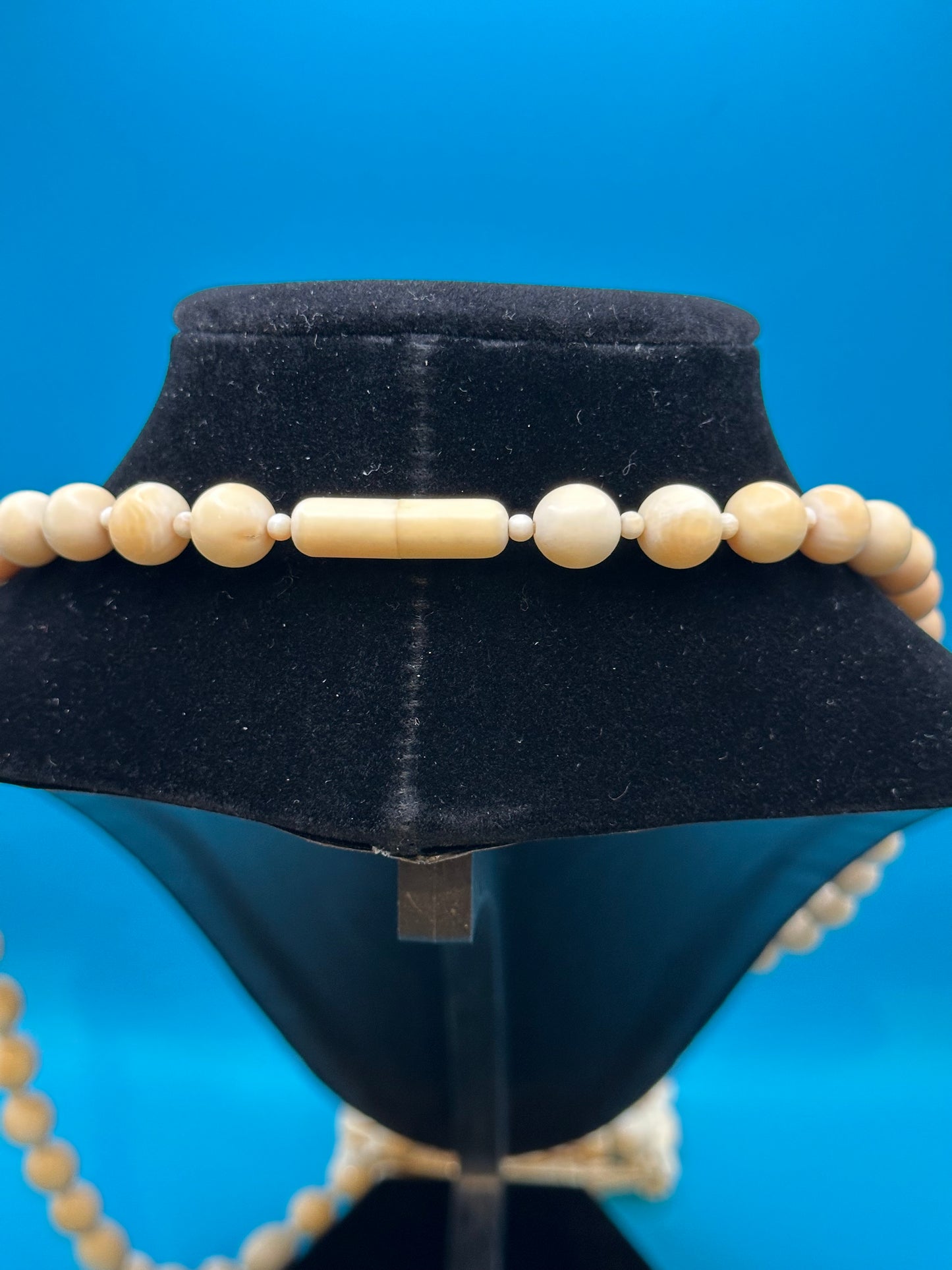 Authentic ivory necklace with carved and colored buddha charm