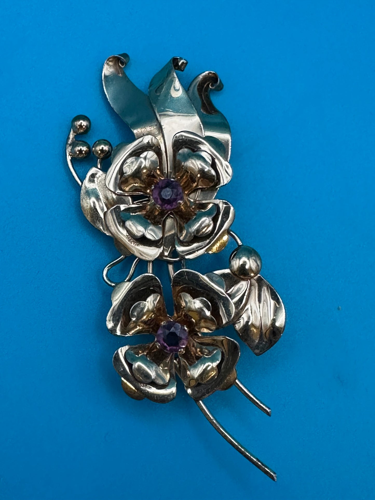 Harry Iskin vintage flower brooch with purple crystals