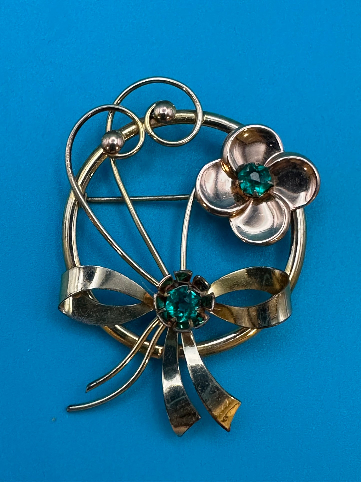 Vintage Harry Iskin green stone flower brooch. Harry Iskin manufactured costume jewelry in Philadelphia in the 1930's-1950's. Marked HI 1/20 10k gf