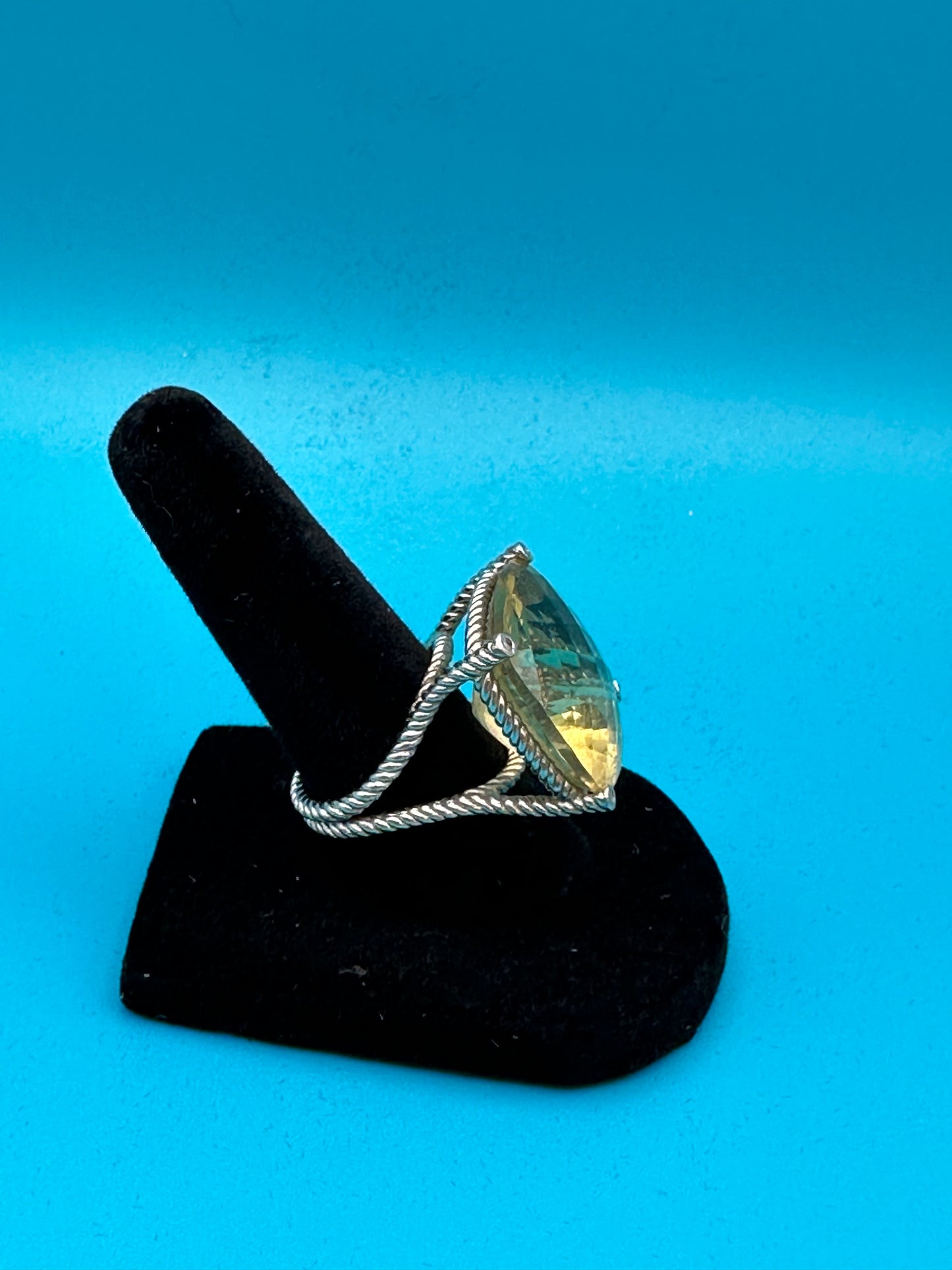 Lemon quartz cushion-cut stone in a sterling silver ring in rope setting