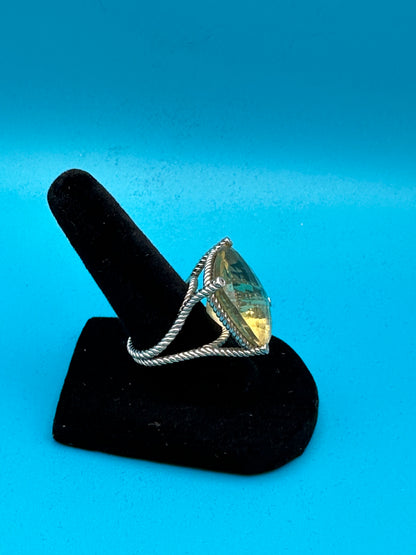 Lemon quartz cushion-cut stone in a sterling silver ring in rope setting