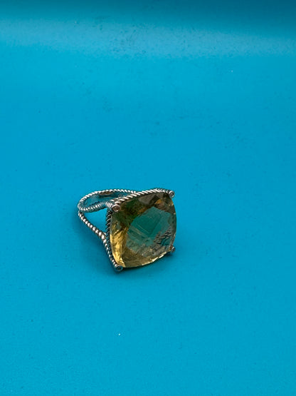 Lemon quartz cushion-cut stone in a sterling silver ring in rope setting