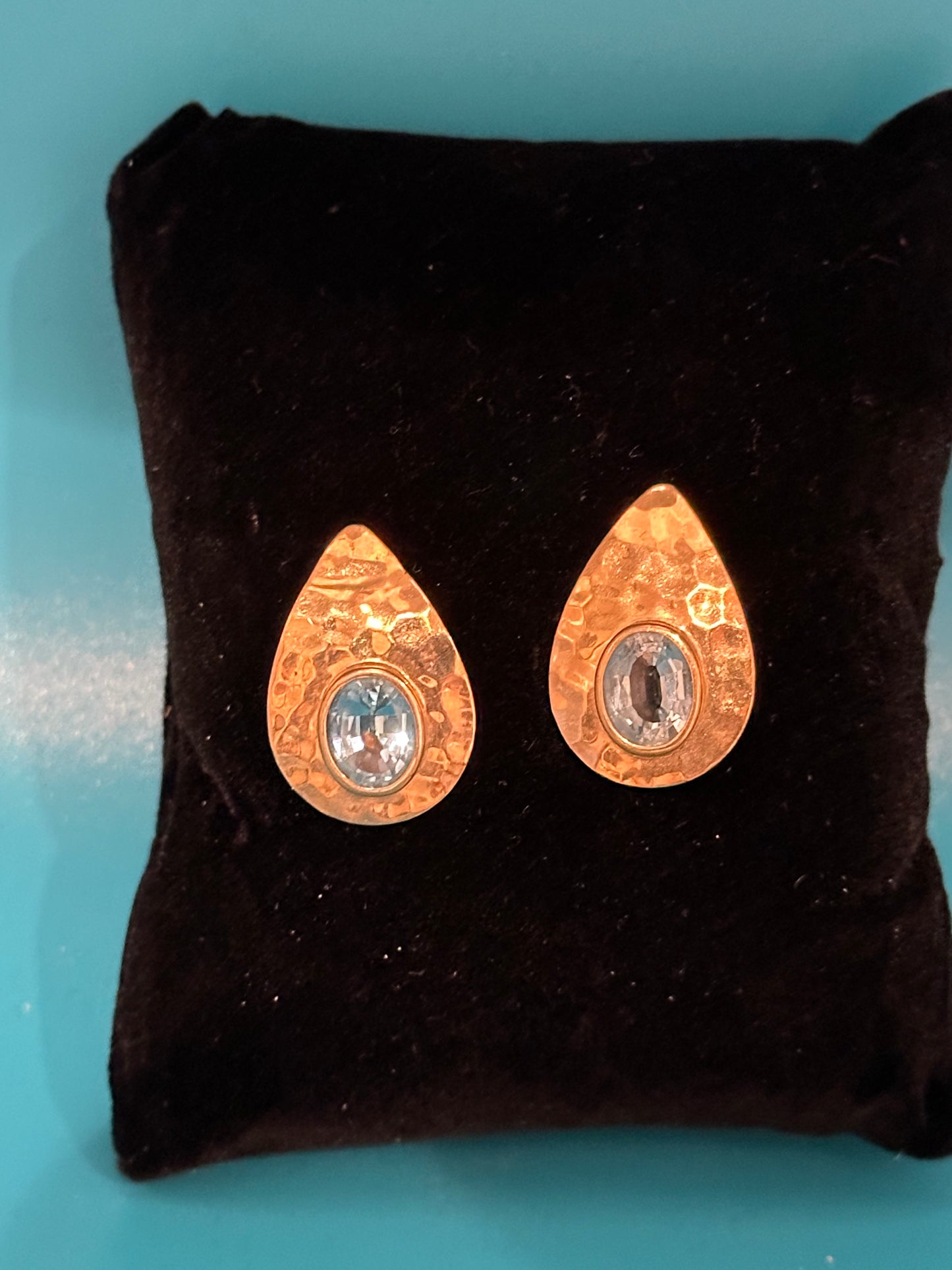 Contemporary hammered gold and blue topaz post earrings