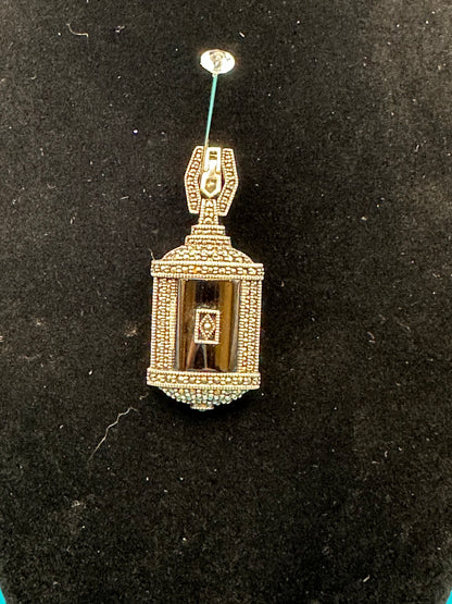 Sterling silver and onyx marcasite pendant