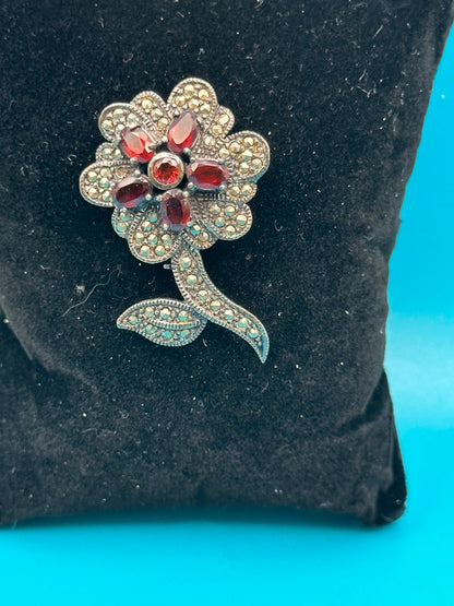 Vintage 925 sterling silver, marcasite, and garnet flower brooch