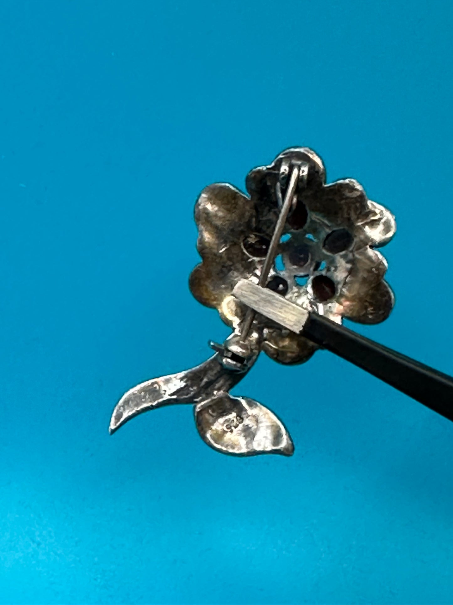 Vintage 925 sterling silver, marcasite, and garnet flower brooch