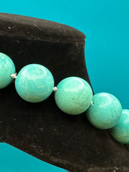 Vintage turquoise choker necklace. There are knots between each bead. Very large beads with silver metal clasp. Excellent condition