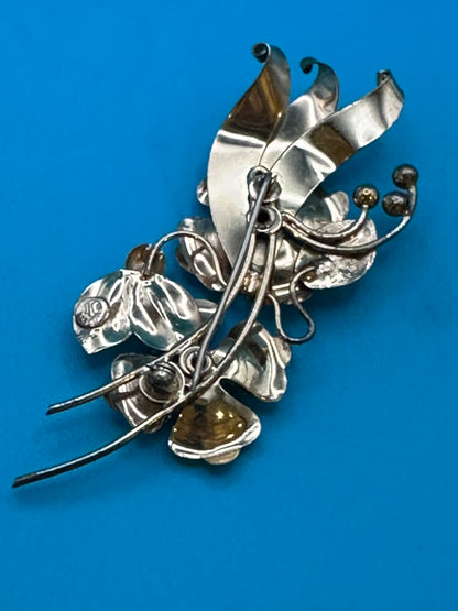 Harry Iskin vintage flower brooch with purple crystals